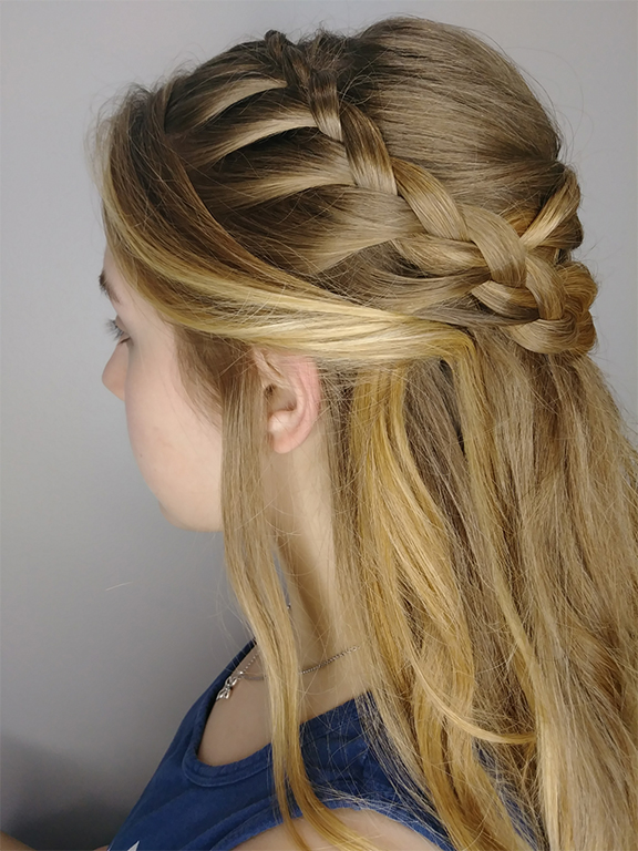 Side profile of a woman with an intricate braided hairstyle. - K. Charles & Co. in Schertz, TX