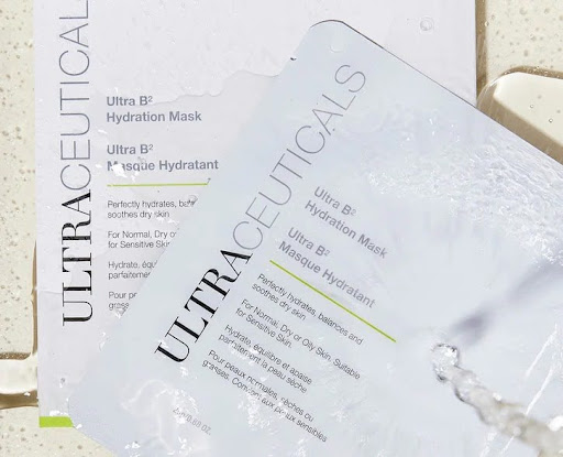 Two Ultraceuticals Ultra B2 Hydration Mask packages, one partially open, on a light surface. - K. Charles & Co. in Schertz, TX